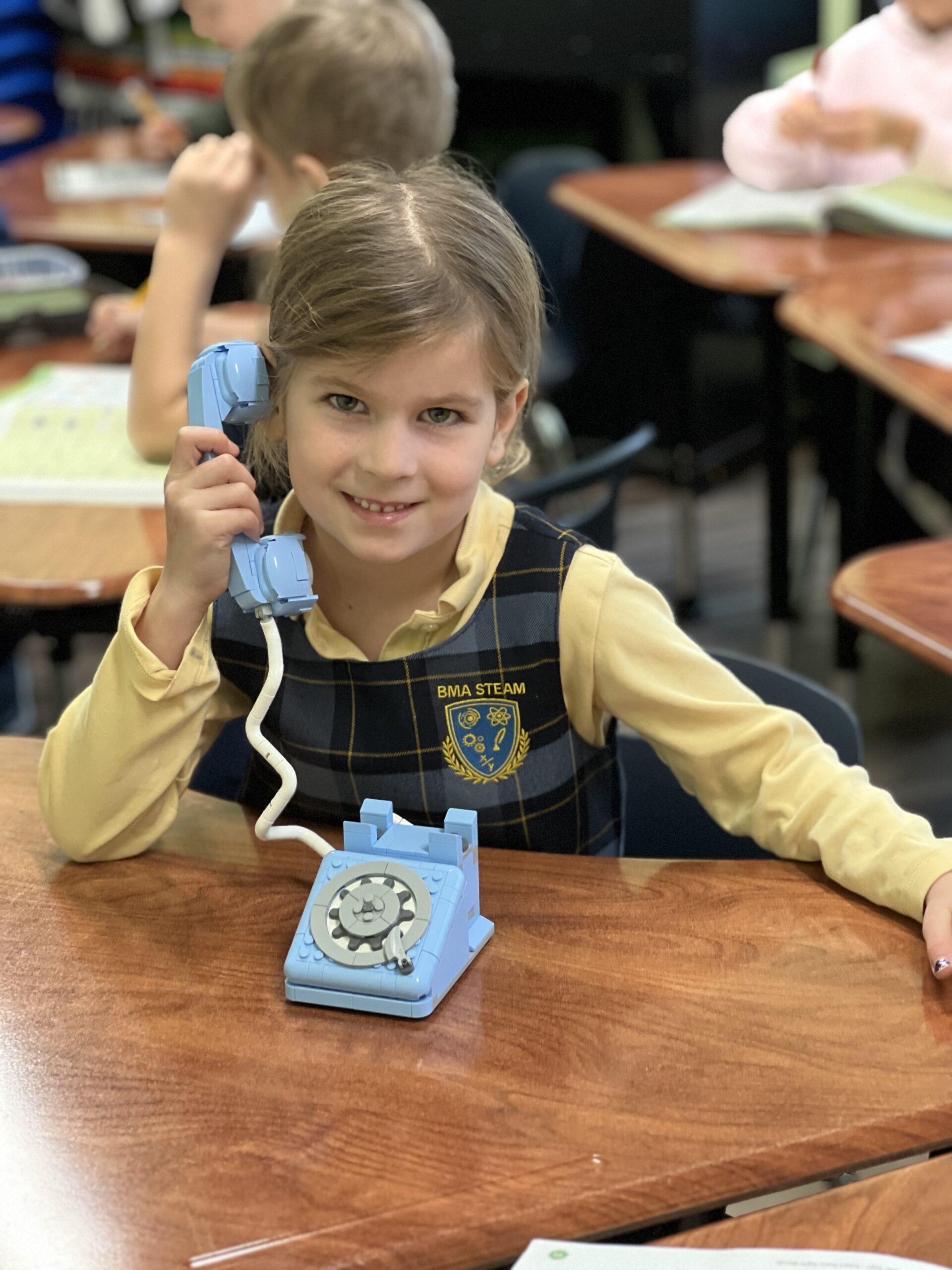 Student wearing the approved plaid uniform dress
